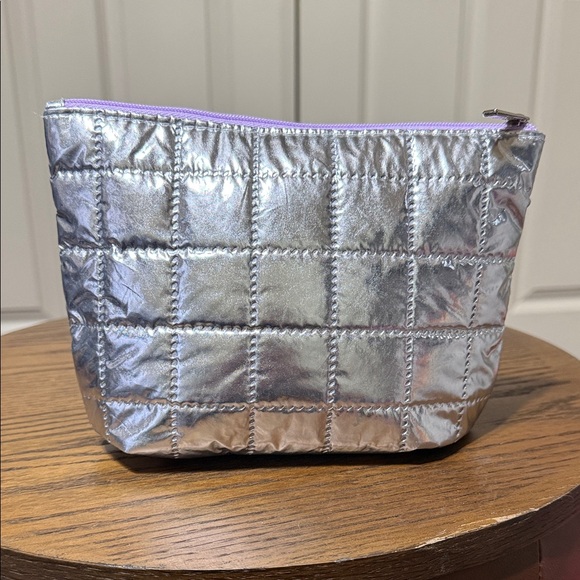 Clinique Handbags - Clinique Silver Quilted cosmetics bag